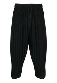 Homme Plissé Issey Miyake pleated tapered cropped trousers - Schwarz