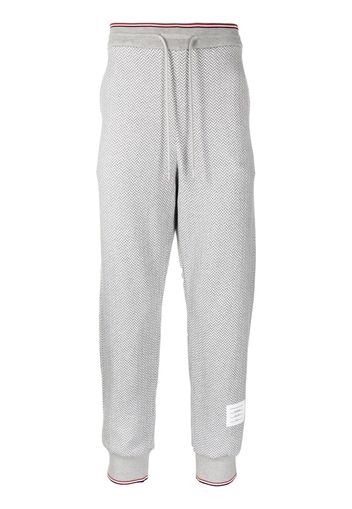 Thom Browne herringbone-pattern logo-patch track pants - Grau