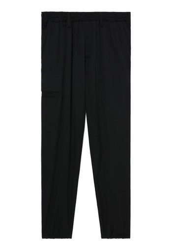 Yohji Yamamoto logo-patch wool trousers - Schwarz