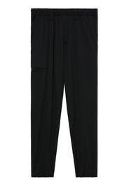 Yohji Yamamoto logo-patch wool trousers - Schwarz