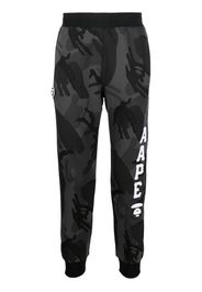 A BATHING APE® camouflage logo-print track pants - Nero