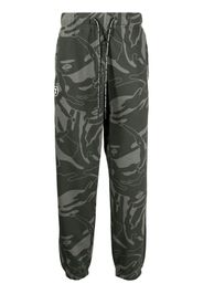 AAPE BY *A BATHING APE® graphic-print tapered trousers - Verde
