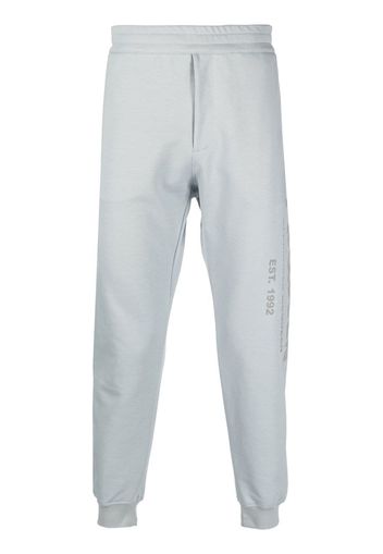 Alexander McQueen logo-print cotton track pants - Grigio