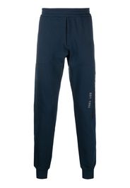 Alexander McQueen Pantaloni sportivi con stampa graffiti - Blu