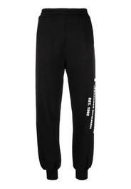 Alexander McQueen logo-print tapered track pants - Nero