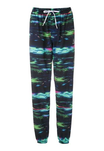 + Olympikus printed nylon trousers