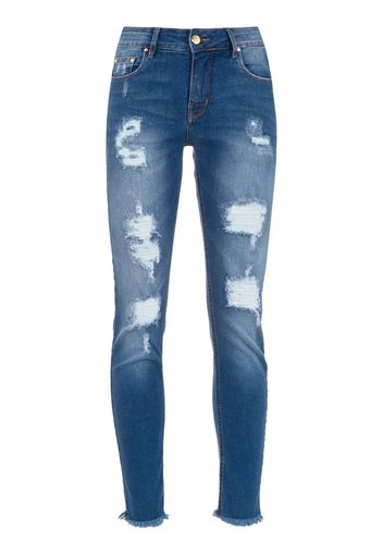 Jeans skinny con effetto vissuto