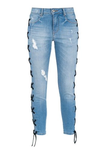 Jeans skinny con lacci