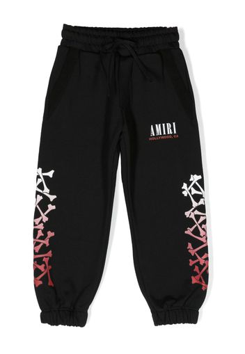 AMIRI KIDS Bones-print track pants - Nero