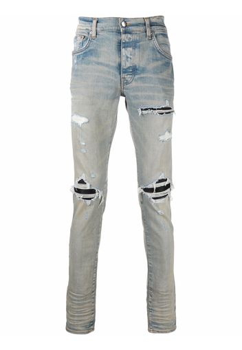 AMIRI distressed-finish ripped skinny jeans - Blu