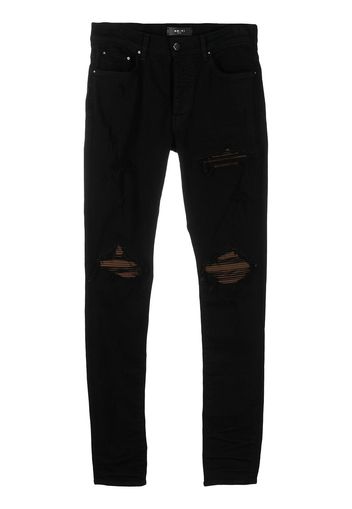 AMIRI distressed ultra suede jeans - Nero