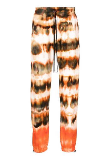 AMIRI tie-dye print cotton track pants - Marrone