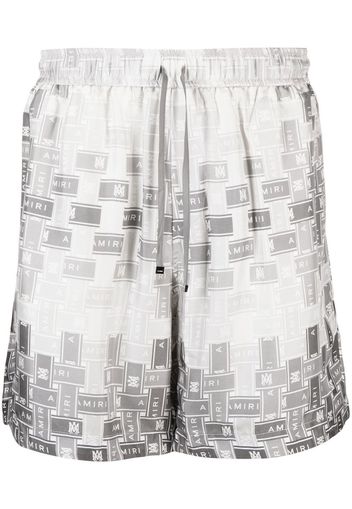 AMIRI pattern-logo-printed silk shorts - Grigio