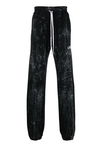 AMIRI cracked-dye logo track pants - Nero