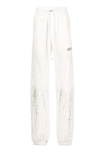 AMIRI cracked-print track pants - Bianco