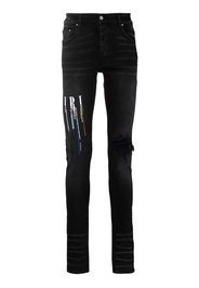 AMIRI logo-embroidered skinny jeans - Nero