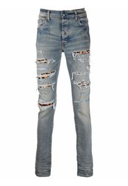 AMIRI ripped-detail denim jeans - Blu