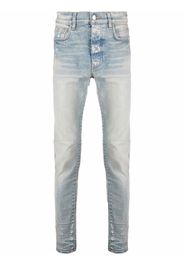 AMIRI logo-patch stonewashed skinny jeans - Blu