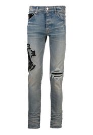 AMIRI logo-embroidered skinny jeans - Blu
