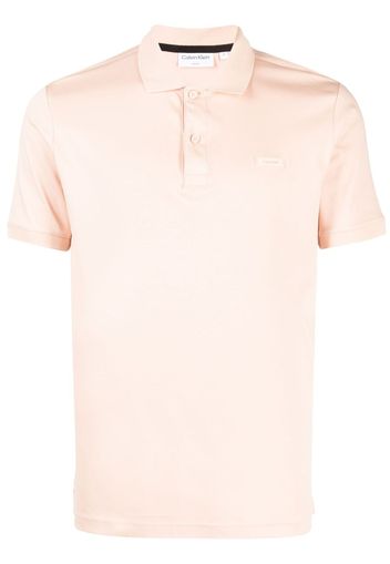 Calvin Klein logo-patch cotton polo shirt - Rosa