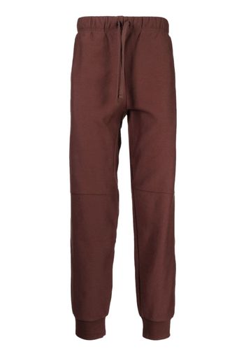 Carhartt WIP Pantaloni sportivi con logo goffrato - Rosso