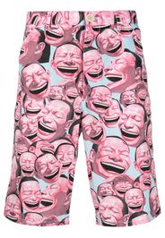 Comme Des Garçons Shirt Laughter print shorts - Rosa