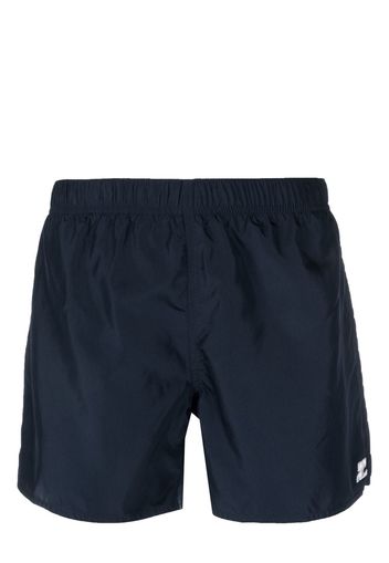 Courrèges logo-patch plain swim shorts - Blu