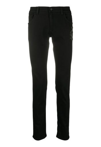 skinny jeans with logo embellishment