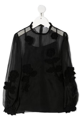 Blusa semi trasparente con ricamo