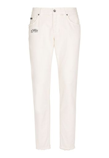 Dolce & Gabbana Jeans slim con placca logo - Bianco