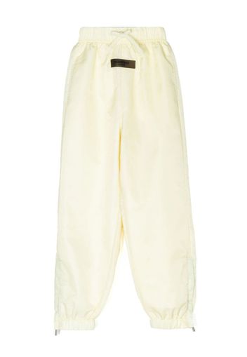 FEAR OF GOD ESSENTIALS logo-patch track pants - Toni neutri