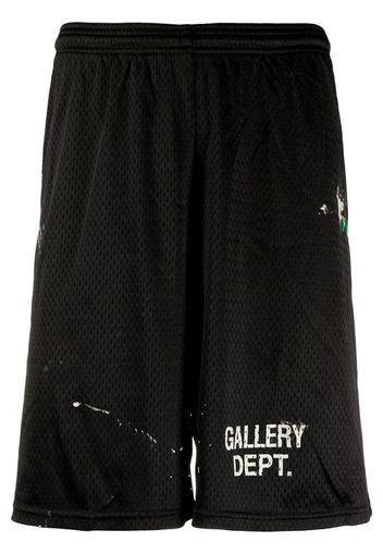 paint-splatter logo track shorts