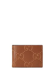 Gucci Portafoglio bi-fold GG goffrato - Marrone