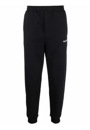 Helmut Lang logo-print tapered track pants - Nero