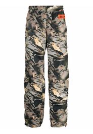 Heron Preston Pantaloni sportivi con stampa camouflage - Verde