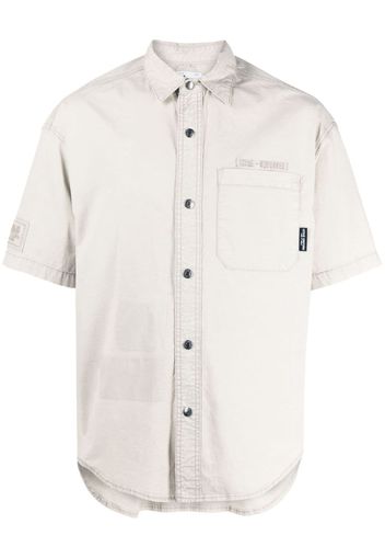 izzue embroidered-logo stretch-cotton shirt - Toni neutri