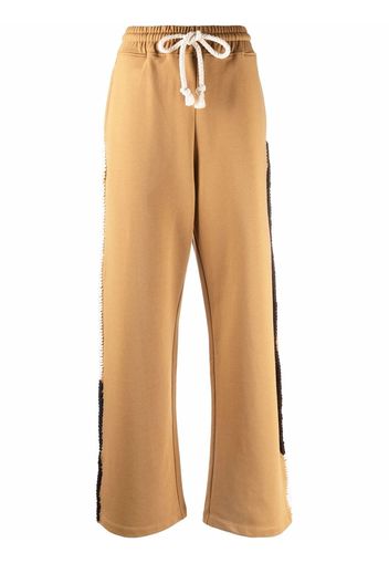 JW Anderson Pantaloni sportivi con bande laterali - Marrone