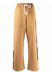 JW Anderson Pantaloni sportivi con bande laterali - Marrone