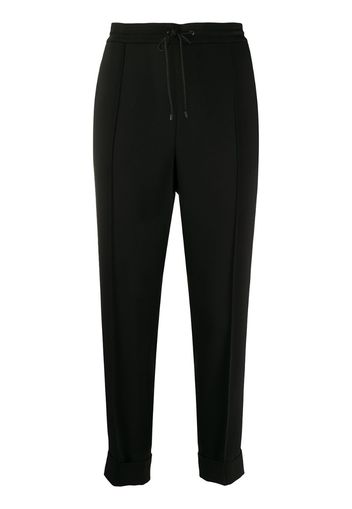 pleated tapered-leg trousers