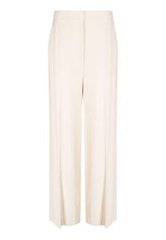 KHAITE high-waisted wide-leg trousers - Toni neutri