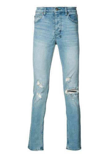 Jeans skinny strappati