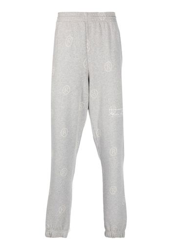 Martine Rose all-over logo-print track pants - Grigio