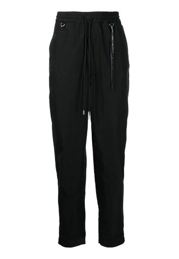 Mastermind World logo-print tapered-leg trousers - Nero