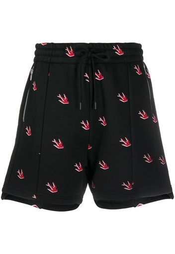 swallow-print track shorts