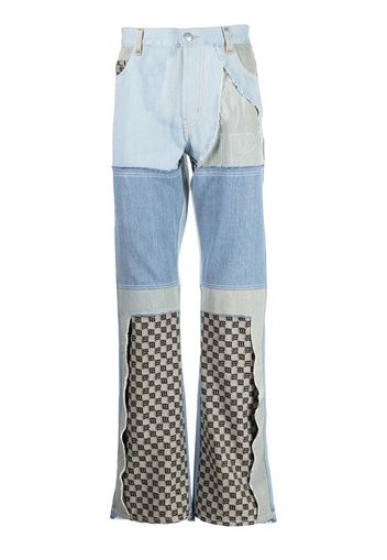 MISBHV upcycled monogram-patchwork jeans - Blu