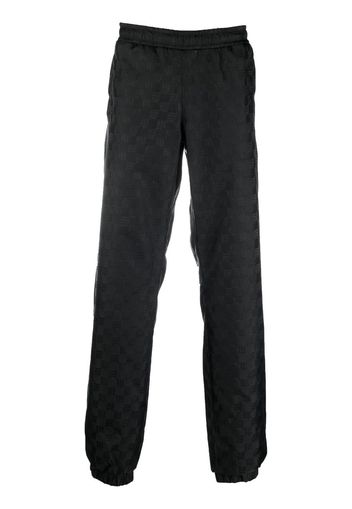 MISBHV monogram-pattern track pants - Nero