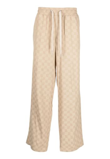 MISBHV logo-print wide-leg trousers - Toni neutri