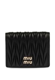 MIU MIU Portafoglio matelassé con placca logo - Nero