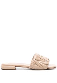 Miu Miu matelassé leather slides - Toni neutri