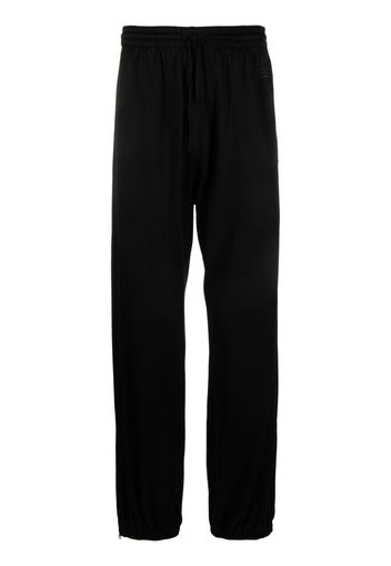 MM6 Maison Margiela Pantaloni sportivi con stampa - Nero